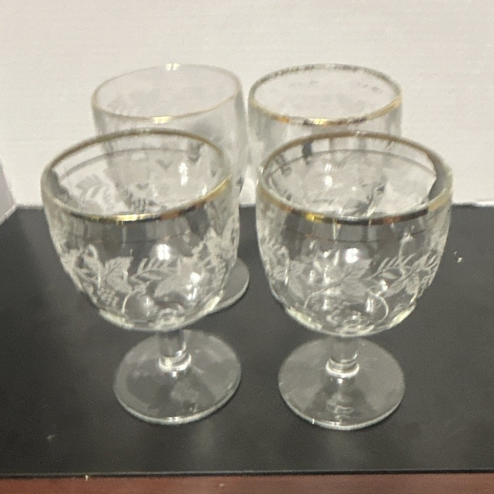 A vintage set of 7 Bartlett Collins Grape Leaf clear thumbprint goblets